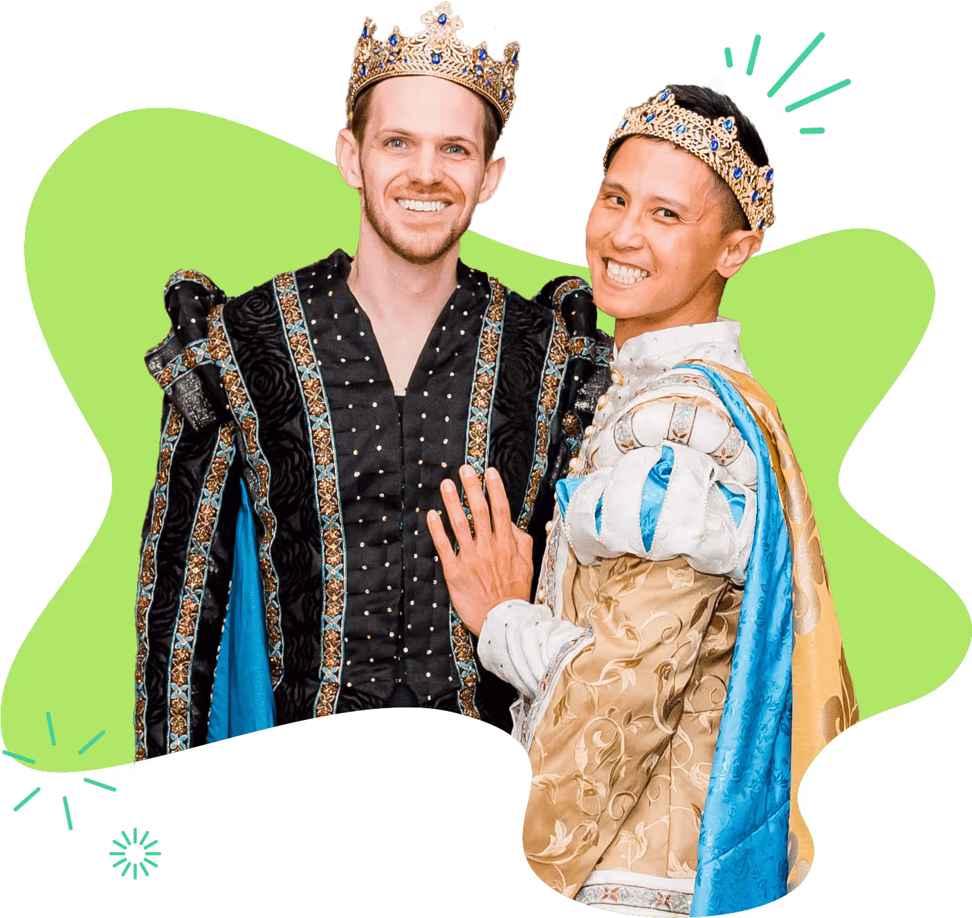 Two smiling men dressed in medieval costumes and wearing crowns